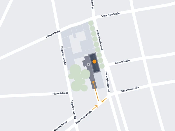 Eine schematische Darstellung eines Straßennetzes, das einen bestimmten Standort zeigt. Geplant sind eine Reihe von Straßen mit benannten Wegen wie Lindenstraße, Engelstraße und Mozartstraße, sowie die Markierung des Standorts auf dem Plan. Pfeile deuten auf die Zugangswege hin.