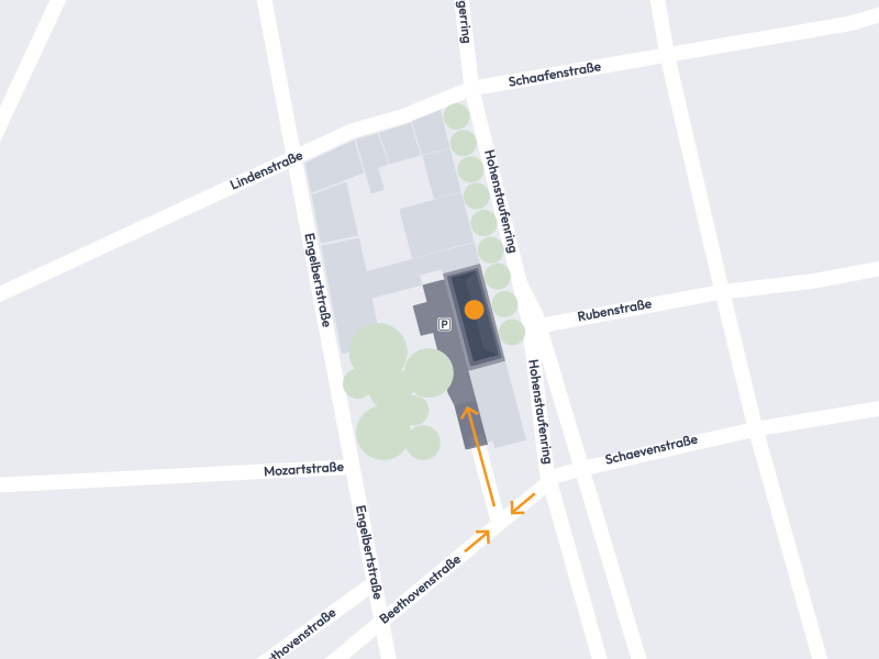 Eine schematische Darstellung eines Straßennetzes, das einen bestimmten Standort zeigt. Geplant sind eine Reihe von Straßen mit benannten Wegen wie Lindenstraße, Engelstraße und Mozartstraße, sowie die Markierung des Standorts auf dem Plan. Pfeile deuten auf die Zugangswege hin.